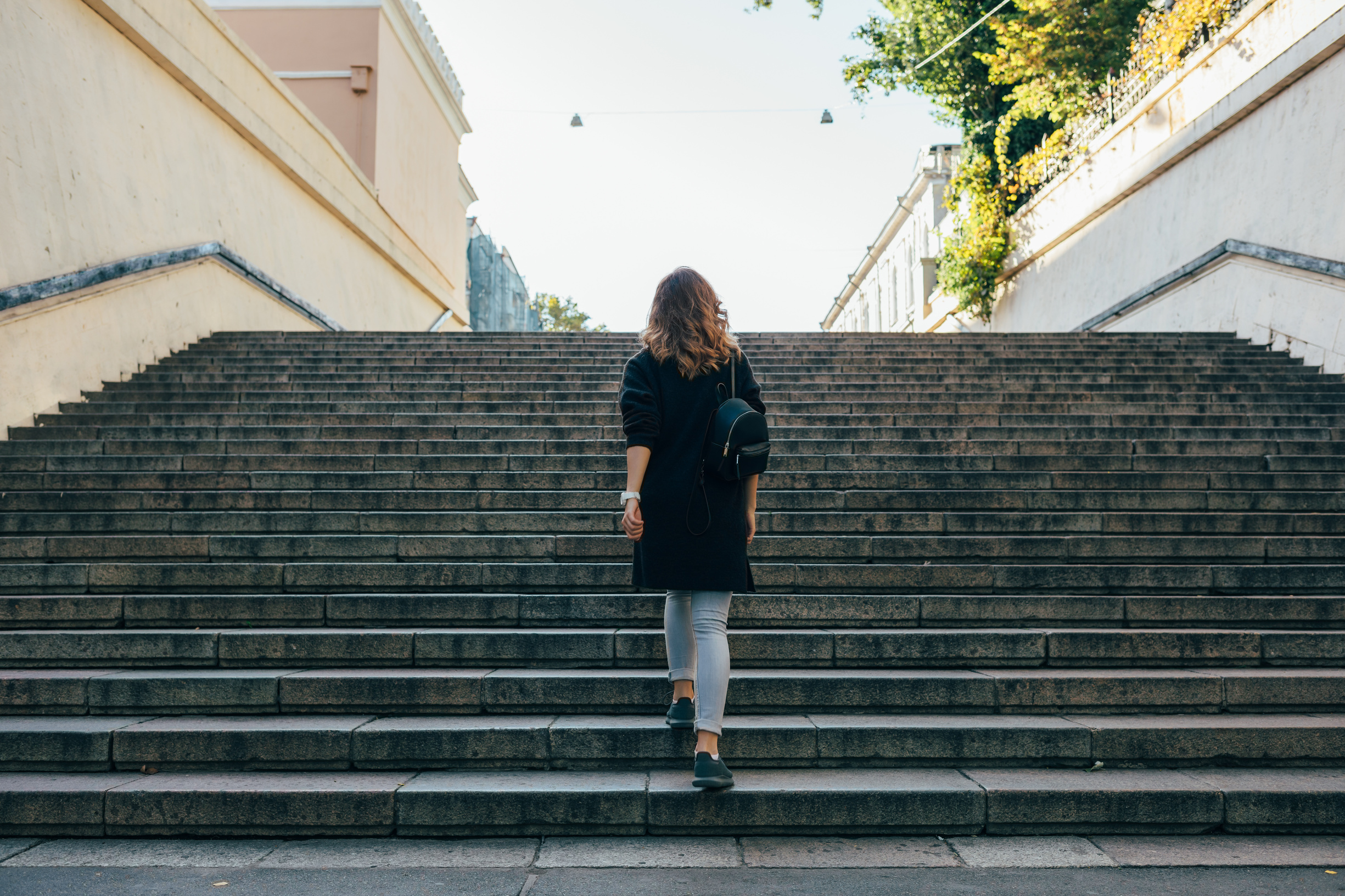 Woman Walking Up the Stairs